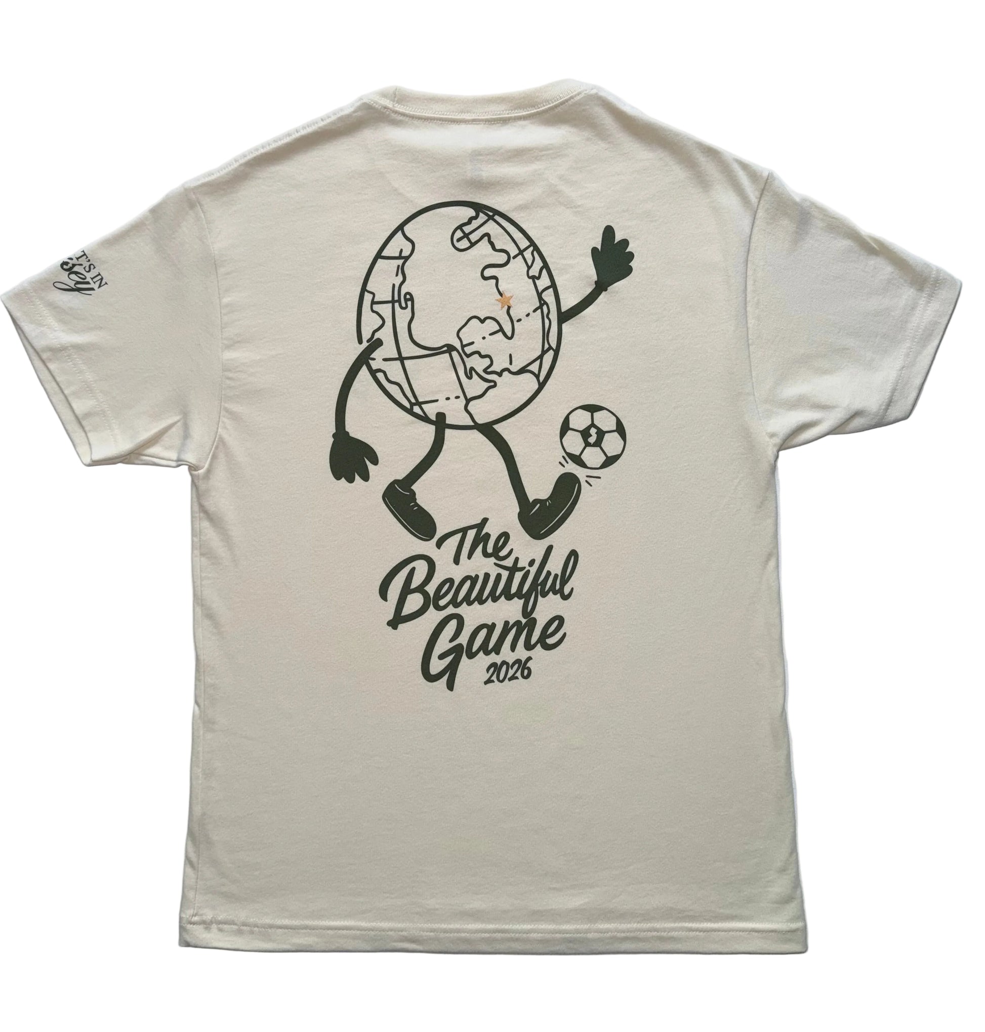Natural t-shirt with a large globe mid kick graphic with 'The Beautiful Game 2026' text on the back