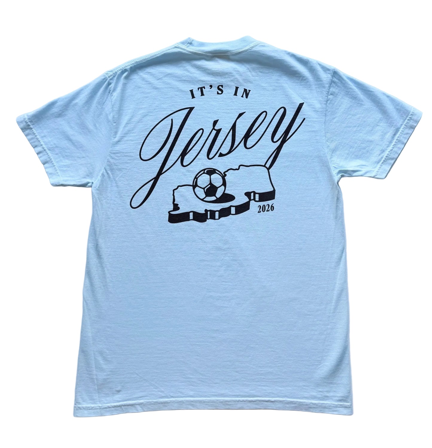 Light blue t-shirt with It's in Jersey logo and state with soccer ball graphic on back