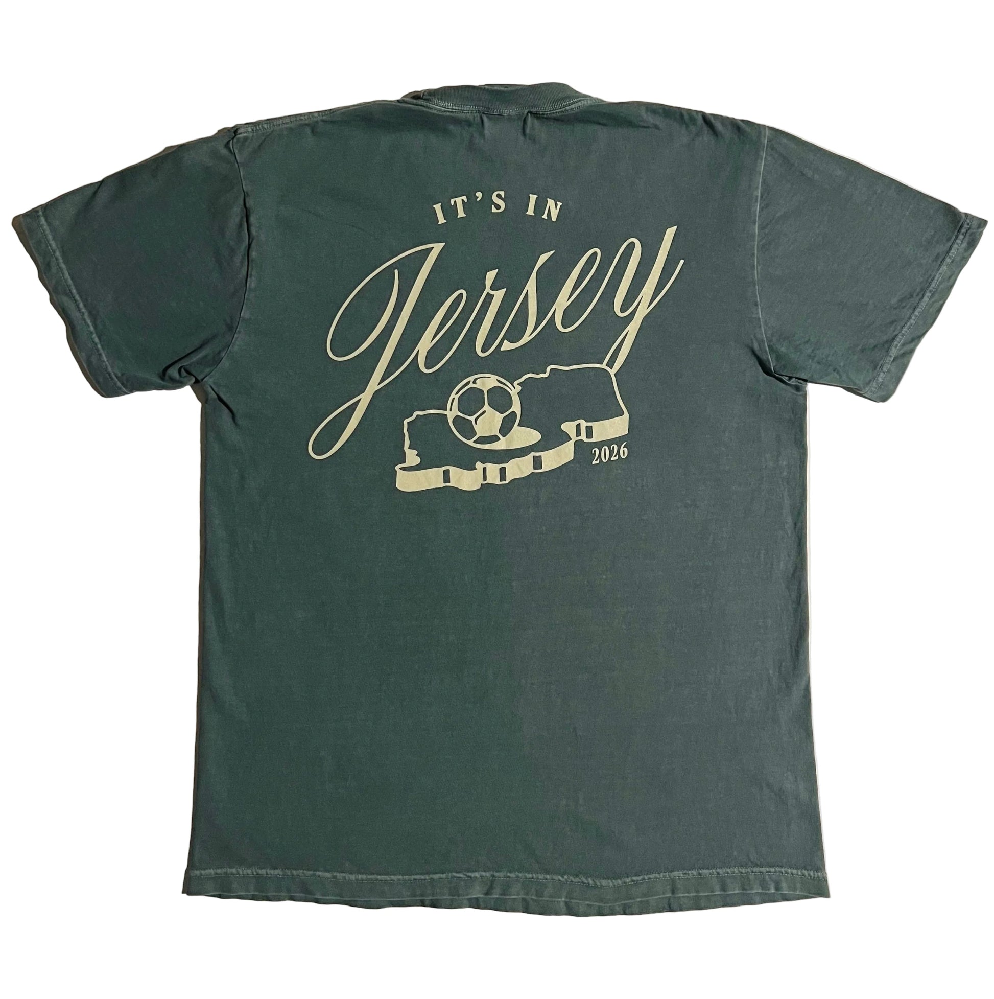 Green t-shirt with It's in Jersey logo and state with soccer ball graphic on back